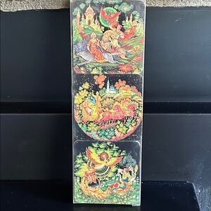 Russian Palekh lacquer coasters feat miniature paintings of fairy tale scenes